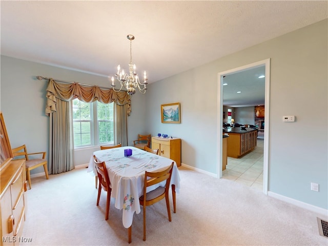 4171 Appleridge Ln, Richfield, OH 44286 - dining space featuring a chandelier, light carpet, and baseboards