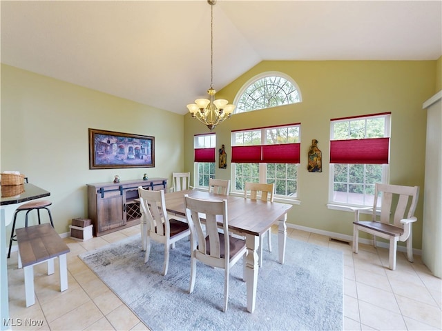 4171 Appleridge Ln, Richfield, OH 44286 - dining space with light tile patterned flooring, a chandelier, high vaulted ceiling, and baseboards