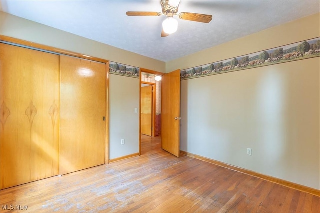 17444 Old State Rd, Middlefield, OH 44062 - unfurnished bedroom featuring light wood finished floors, baseboards, and a ceiling fan
