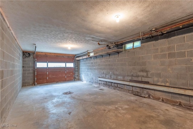 17444 Old State Rd, Middlefield, OH 44062 - garage featuring concrete block wall