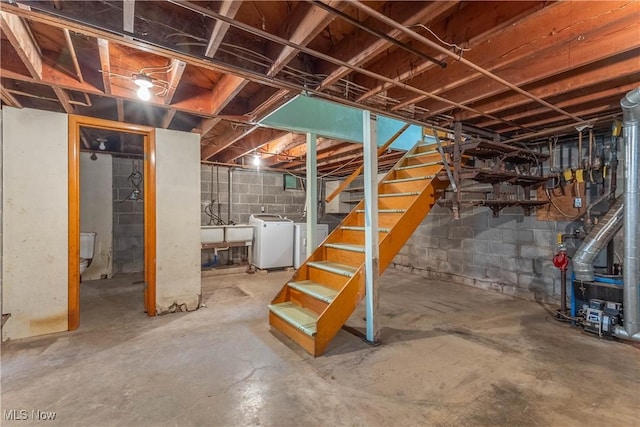 17444 Old State Rd, Middlefield, OH 44062 - unfinished below grade area with washer and dryer, stairs, and a sink