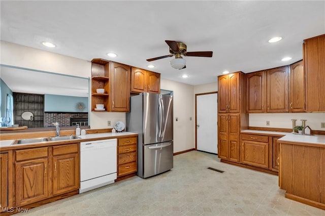 380 Longview Rd, Medina, OH 44256 - kitchen featuring dishwasher, freestanding refrigerator, a sink, brown cabinetry, and ceiling fan