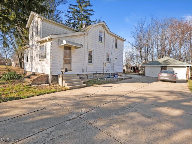 3000 Spitler Rd, Youngstown, OH 44514 - view of home's exterior with a garage and an outbuilding