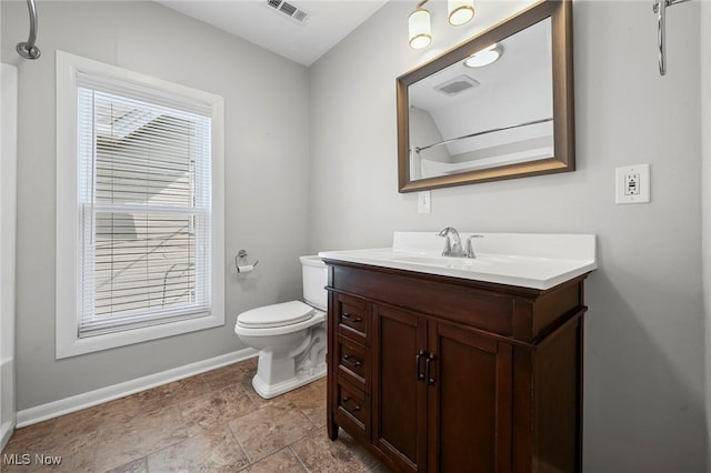 2450 Tremont Ave, Cleveland, OH 44113 - full bath featuring vanity, plenty of natural light, stone finish floors, and a shower