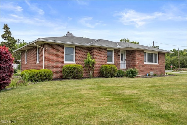 4002 Canterbury Ct, Lorain, OH 44053 - ranch-style home with brick siding, a front yard, and a chimney