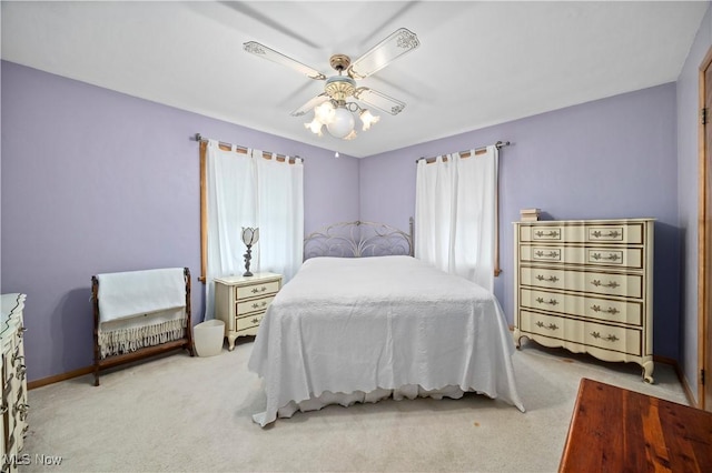 4002 Canterbury Ct, Lorain, OH 44053 - bedroom featuring light colored carpet, baseboards, and ceiling fan