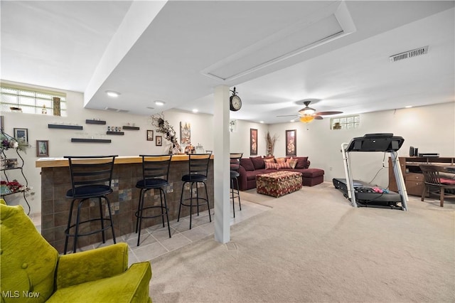 4002 Canterbury Ct, Lorain, OH 44053 - carpeted living room featuring a dry bar, attic access, and a ceiling fan