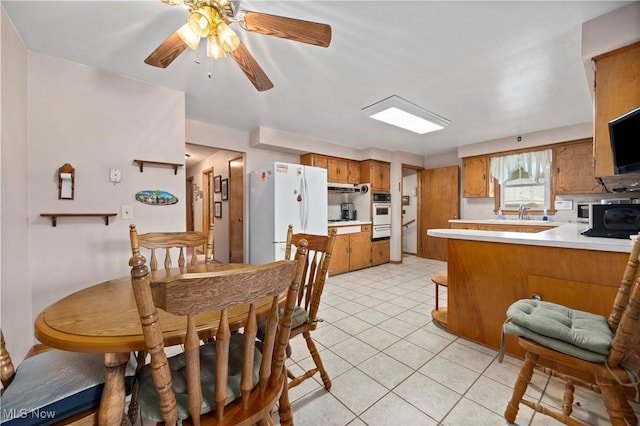 4002 Canterbury Ct, Lorain, OH 44053 - dining area featuring light tile patterned floors and a ceiling fan