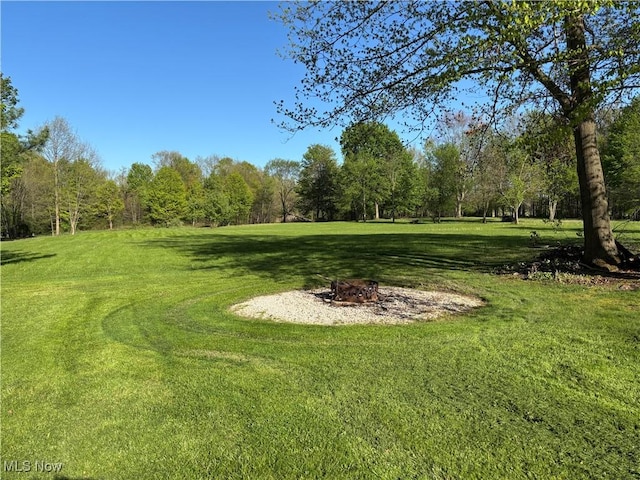 6516 Fee Rd, Rome, OH 44085 - view of grassy yard featuring a fire pit