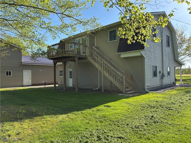 6516 Fee Rd, Rome, OH 44085 - back of property featuring a lawn, a wooden deck, and stairway