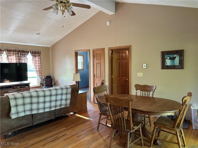 6516 Fee Rd, Rome, OH 44085 - dining area with wood-type flooring, ceiling fan, beamed ceiling, and high vaulted ceiling