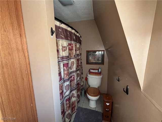 6516 Fee Rd, Rome, OH 44085 - full bathroom with toilet, tile patterned floors, and a textured ceiling