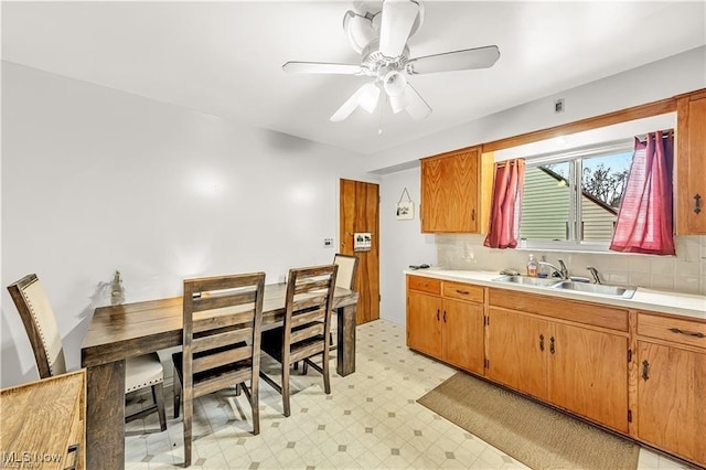 432-434 N Main St, Munroe Falls, OH 44262 - kitchen featuring a sink, light flooring, light countertops, and tasteful backsplash