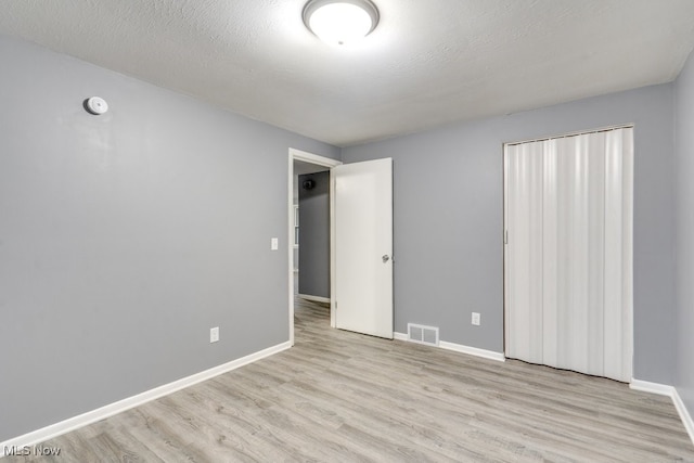2318 3rd St SE, Canton, OH 44707 - unfurnished room with wood finished floors, baseboards, and a smoke detector