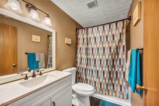 2300 Canterbury Cir, Akron, OH 44319 - full bath with toilet, vanity, a textured ceiling, and a shower with curtain