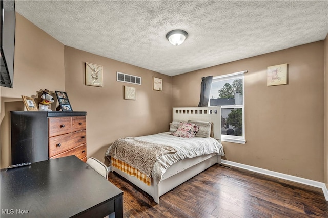 2300 Canterbury Cir, Akron, OH 44319 - bedroom with baseboards, wood finished floors, and a textured ceiling