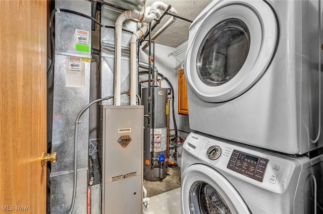 2300 Canterbury Cir, Akron, OH 44319 - washroom featuring stacked washer and clothes dryer and water heater