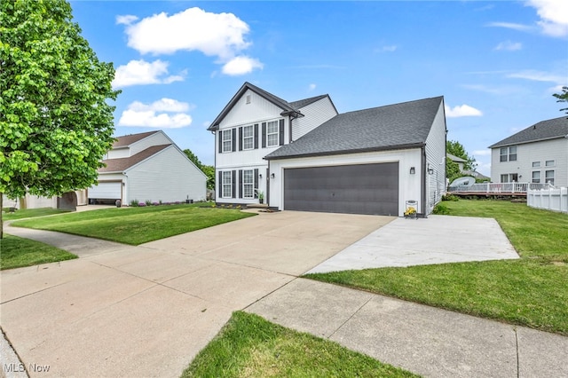 2300 Canterbury Cir, Akron, OH 44319 - traditional-style home featuring concrete driveway, an attached garage, and roof with shingles