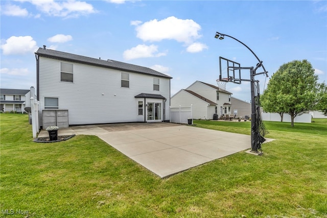 2300 Canterbury Cir, Akron, OH 44319 - rear view of house with a lawn and a patio area