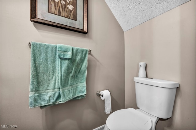 2300 Canterbury Cir, Akron, OH 44319 - bathroom featuring toilet, a textured ceiling, and lofted ceiling