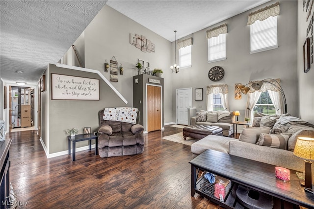 2300 Canterbury Cir, Akron, OH 44319 - living area with hardwood / wood-style floors, a textured ceiling, baseboards, and a high ceiling