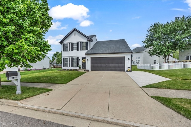 2300 Canterbury Cir, Akron, OH 44319 - traditional home with a garage, driveway, and a shingled roof