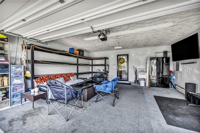 2300 Canterbury Cir, Akron, OH 44319 - garage featuring a garage door opener and freestanding refrigerator