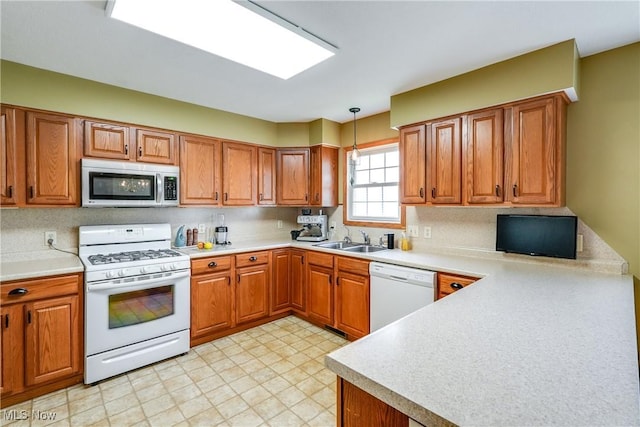 3690 Dornoch Dr, Wooster, OH 44691 - kitchen with white appliances, a sink, and brown cabinetry