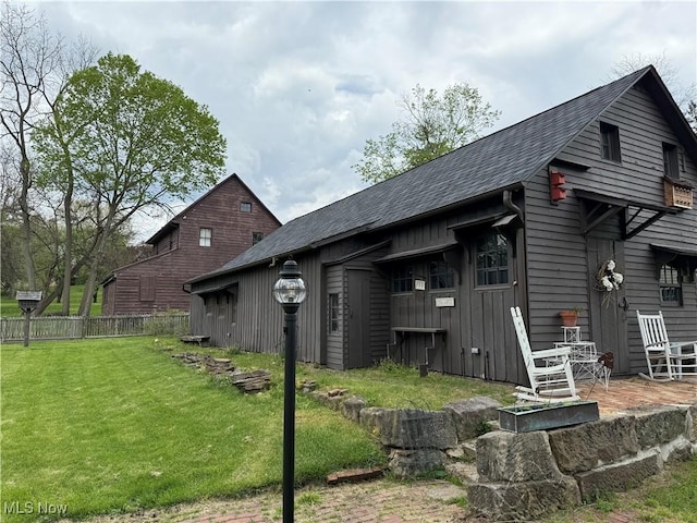 199 E 3rd St, Zoar, OH 44697 - view of home's exterior featuring roof with shingles