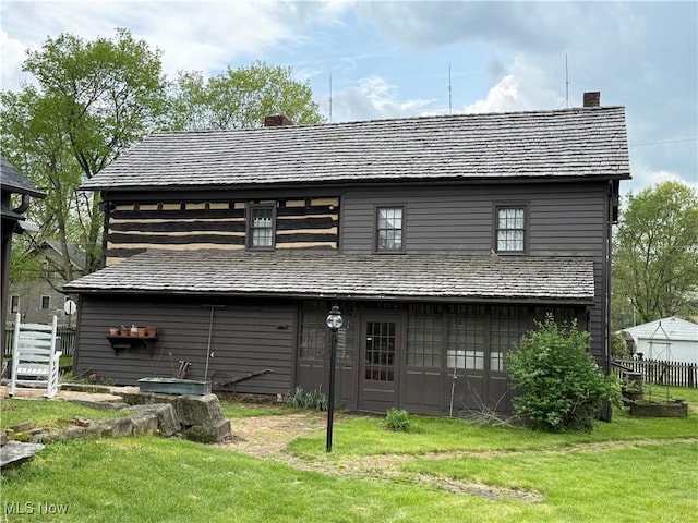 199 E 3rd St, Zoar, OH 44697 - rear view of property with a chimney