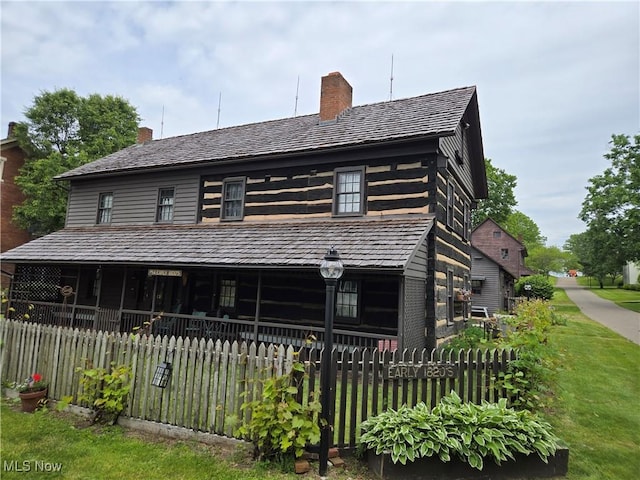 199 E 3rd St, Zoar, OH 44697 - view of front facade featuring a chimney