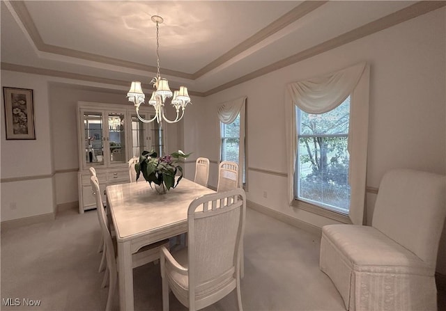 592 Charles Pl, Highland Heights, OH 44143 - dining room featuring light carpet, a chandelier, a tray ceiling, and baseboards