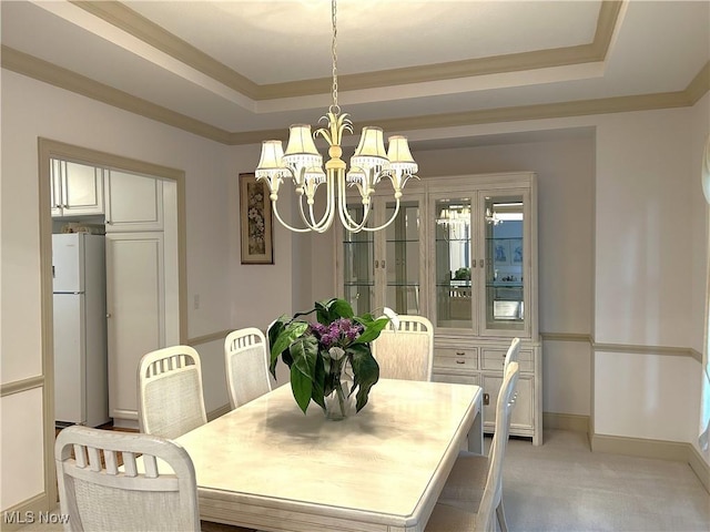 592 Charles Pl, Highland Heights, OH 44143 - dining area featuring a raised ceiling, a chandelier, baseboards, and light carpet