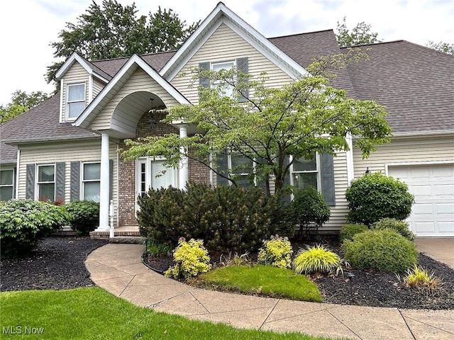 592 Charles Pl, Highland Heights, OH 44143 - view of front of home with a shingled roof, a garage, and brick siding