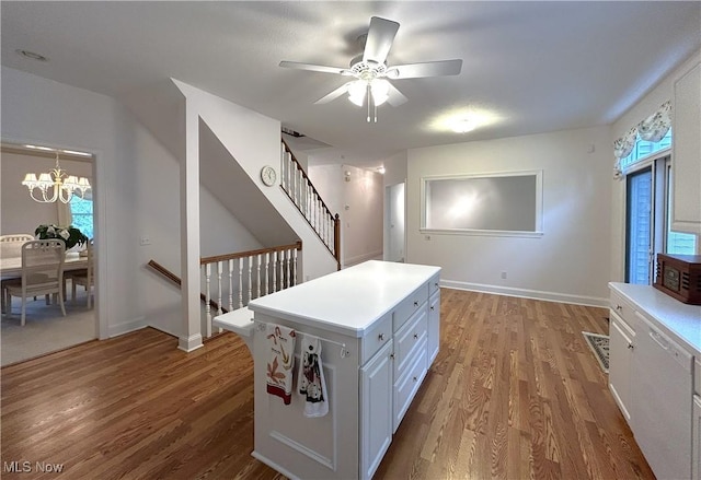 592 Charles Pl, Highland Heights, OH 44143 - interior space with a ceiling fan, wood finished floors, a chandelier, and light countertops