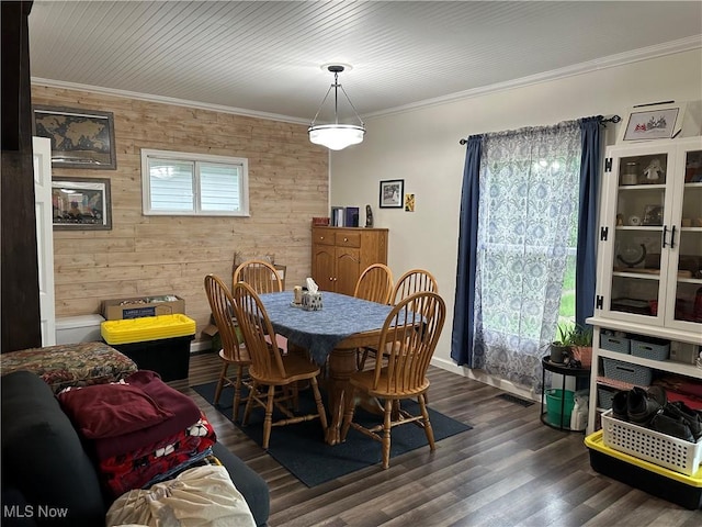 408 W Paradise St, Orrville, OH 44667 - dining room featuring ornamental molding, dark wood-style flooring, wooden walls, and baseboards