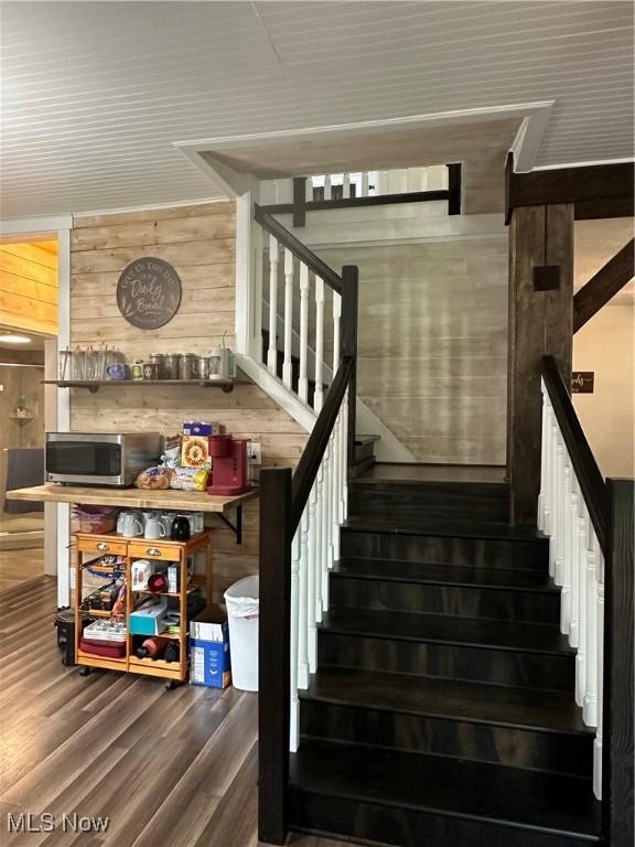 408 W Paradise St, Orrville, OH 44667 - staircase with wood finished floors and wooden walls