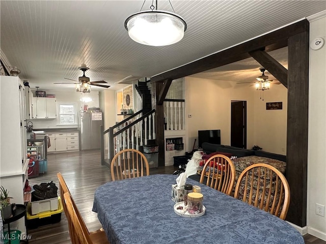 408 W Paradise St, Orrville, OH 44667 - dining room with ceiling fan, stairs, dark wood finished floors, and baseboards