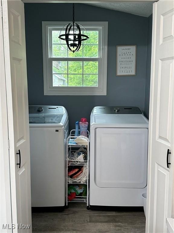 408 W Paradise St, Orrville, OH 44667 - washroom with washer and dryer, dark wood-type flooring, and a chandelier