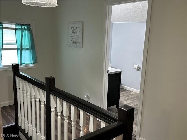 408 W Paradise St, Orrville, OH 44667 - hall with an upstairs landing, baseboards, and wood finished floors