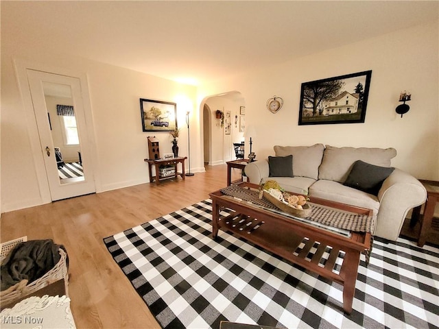 3524 State Rd, Ashtabula, OH 44004 - living room with arched walkways and wood finished floors