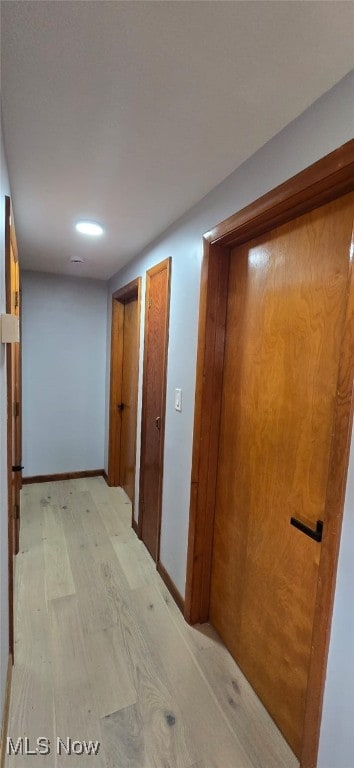 809 4th St, Brilliant, OH 43913 - hallway featuring light wood-style flooring and baseboards