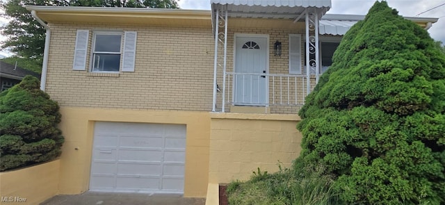 809 4th St, Brilliant, OH 43913 - view of front of property with a garage and brick siding