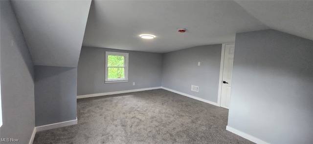 809 4th St, Brilliant, OH 43913 - additional living space with vaulted ceiling, baseboards, and carpet flooring