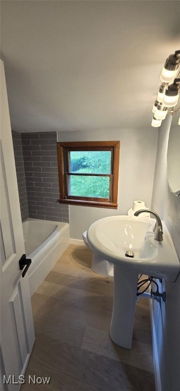 809 4th St, Brilliant, OH 43913 - full bathroom with a tub to relax in and wood finished floors