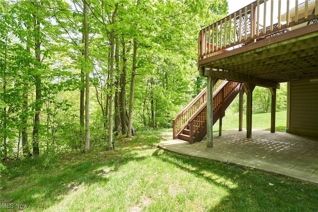 3563 Saint Andrews Ln, Richfield, OH 44286 - view of grassy yard featuring a patio, stairway, and a deck