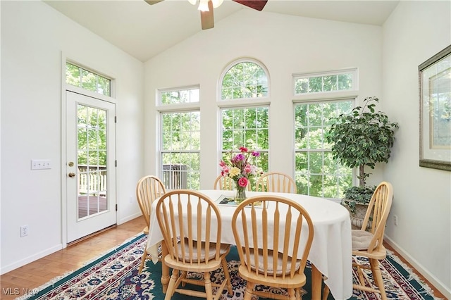 3563 Saint Andrews Ln, Richfield, OH 44286 - dining room with a ceiling fan, baseboards, light wood-style floors, and lofted ceiling
