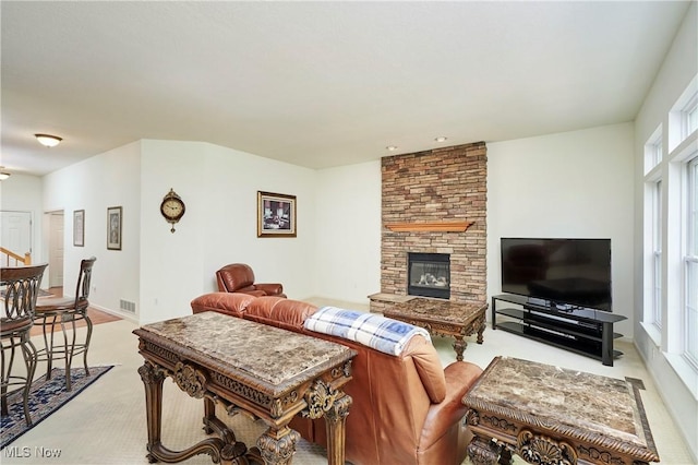 3563 Saint Andrews Ln, Richfield, OH 44286 - living area featuring light carpet and a fireplace