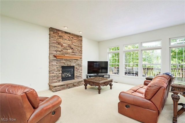 3563 Saint Andrews Ln, Richfield, OH 44286 - living room with carpet flooring, a stone fireplace, and baseboards