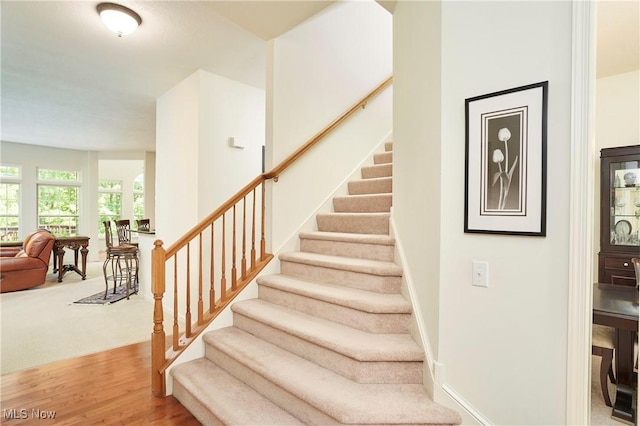 3563 Saint Andrews Ln, Richfield, OH 44286 - stairs featuring wood finished floors and baseboards